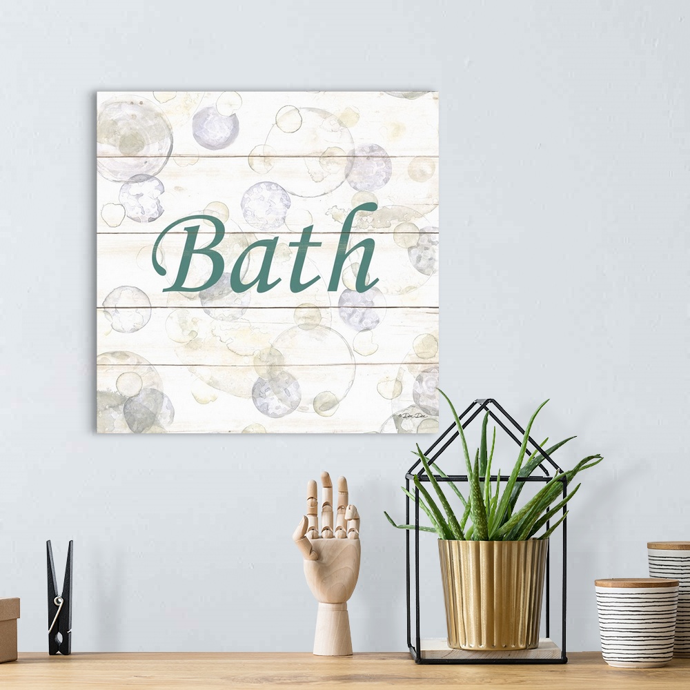A bohemian room featuring The word "Bath" surrounded by bubbles on a light background with a wooden effect.
