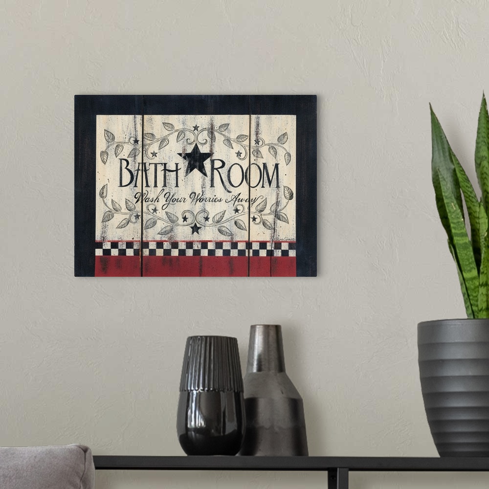 A modern room featuring Decorative artwork featuring the words: Bathroom, wash your worries away, in a rustic country style.