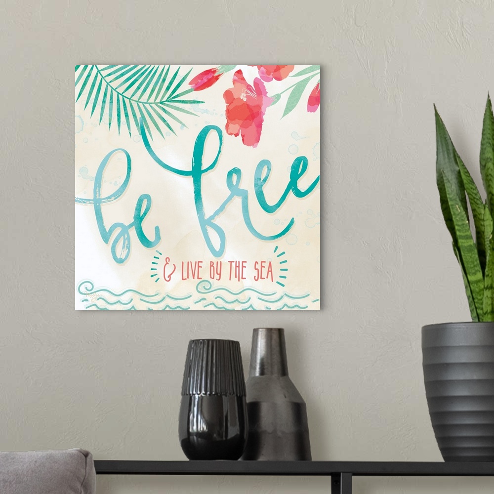 A modern room featuring Beach-themed artwork with "Be Free" in large script with a motif of tropical leaves and flowers.