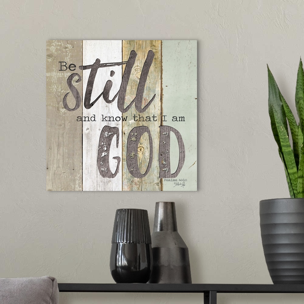 A modern room featuring Bible verse Psalms 46:10 on a background of varied wooden boards.