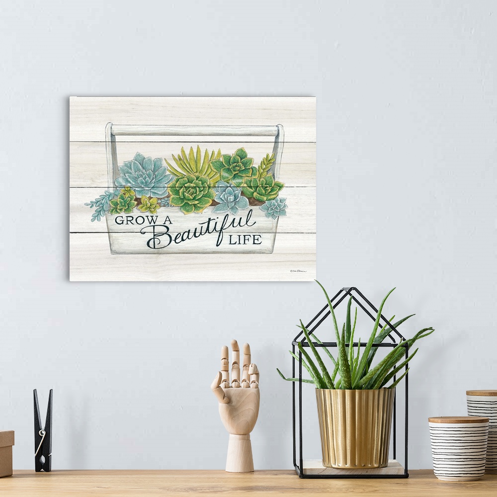A bohemian room featuring The words, grow a beautiful life, are placed over planter filled with bright green and blue succu...