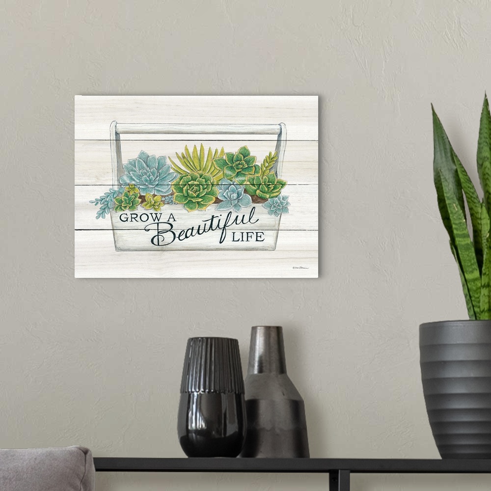 A modern room featuring The words, grow a beautiful life, are placed over planter filled with bright green and blue succu...