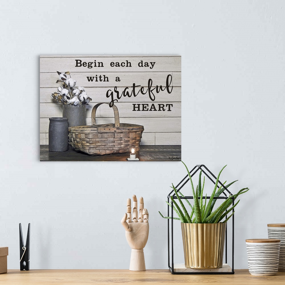A bohemian room featuring This still-life photograph features rustic elements with the words, Begin each day with a gratefu...