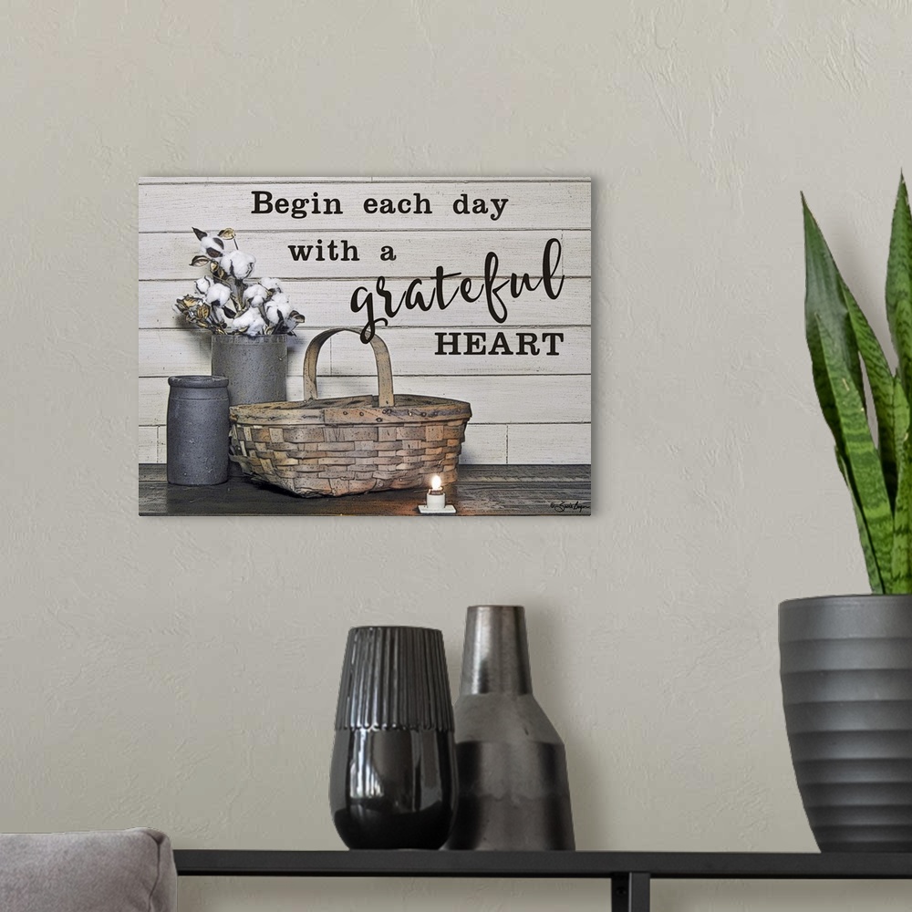 A modern room featuring This still-life photograph features rustic elements with the words, Begin each day with a gratefu...