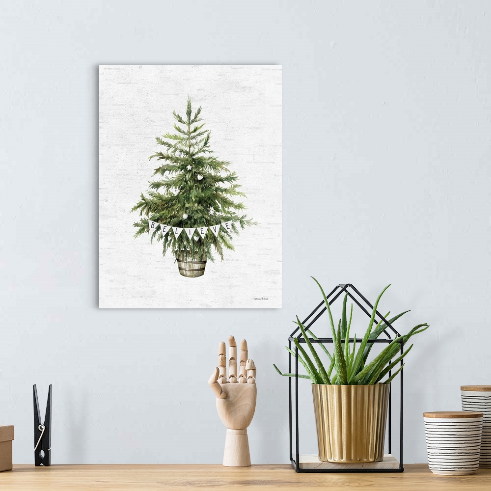 A bohemian room featuring Believe Christmas Tree