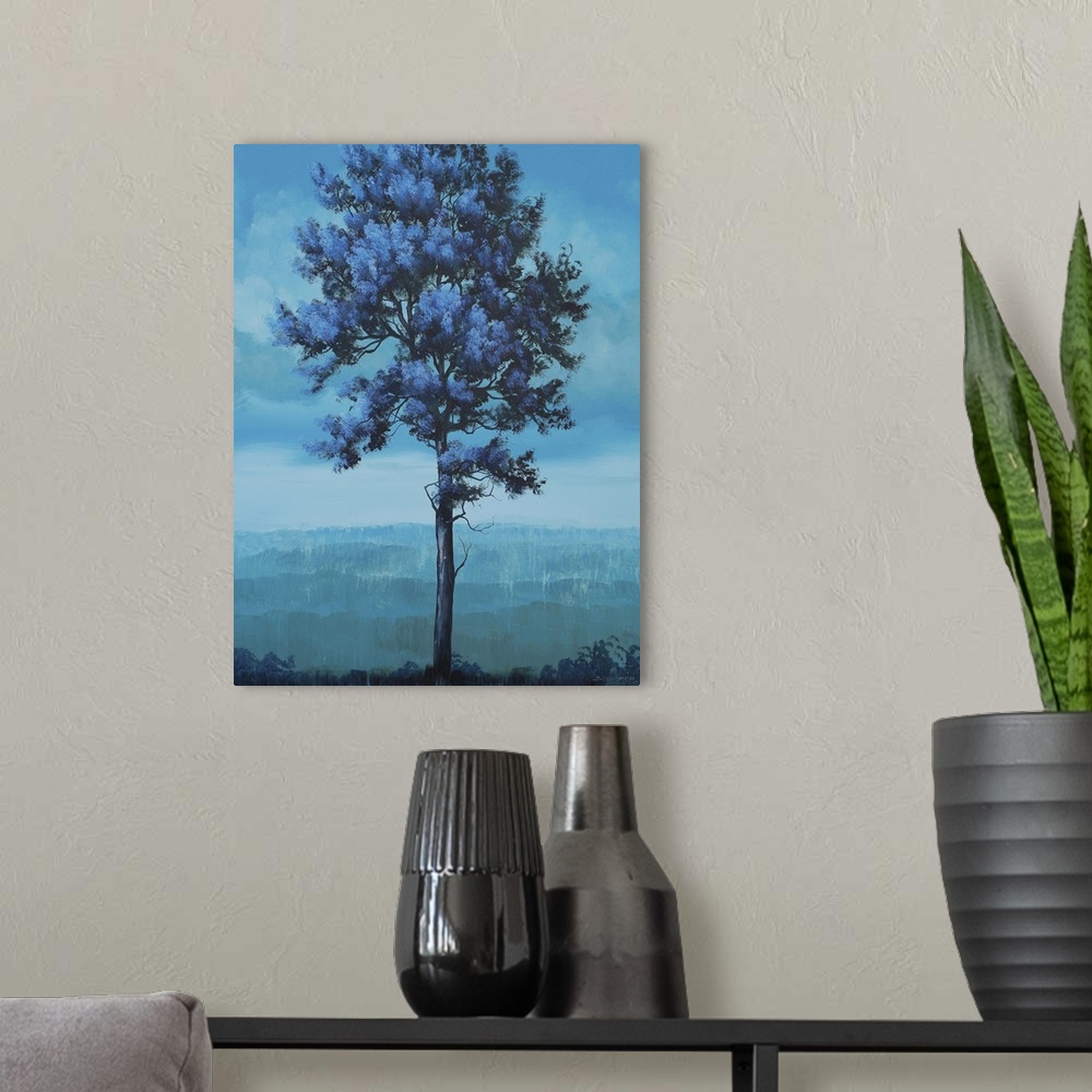 A modern room featuring Contemporary artwork of a tall tree in a field in shades of blue.