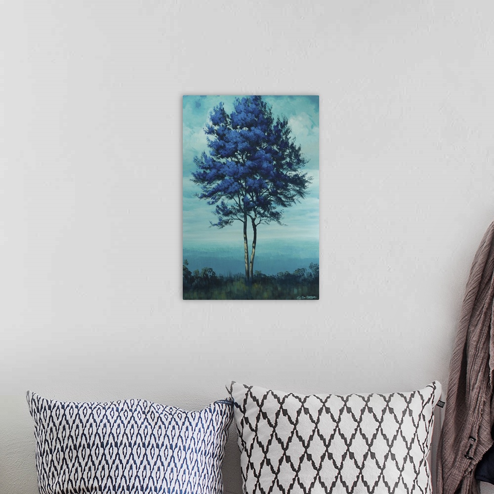 A bohemian room featuring Painting of a tall blue tree under a cloudy sky.