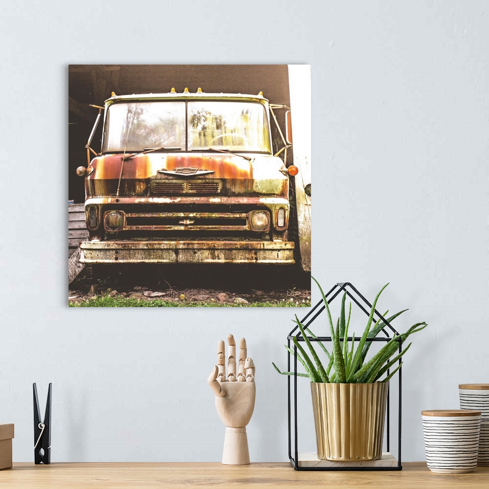 A bohemian room featuring Photograph of a rusted and abandoned Chevrolet truck.