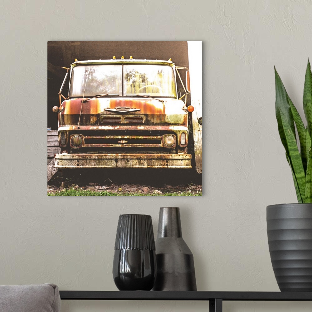 A modern room featuring Photograph of a rusted and abandoned Chevrolet truck.
