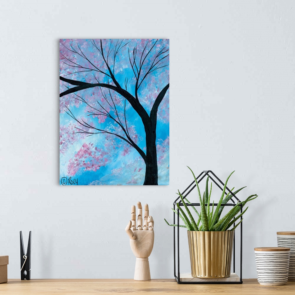 A bohemian room featuring Vertical contemporary painting of a Cherry Blossoms Tree surrounded by brilliant blue skies.