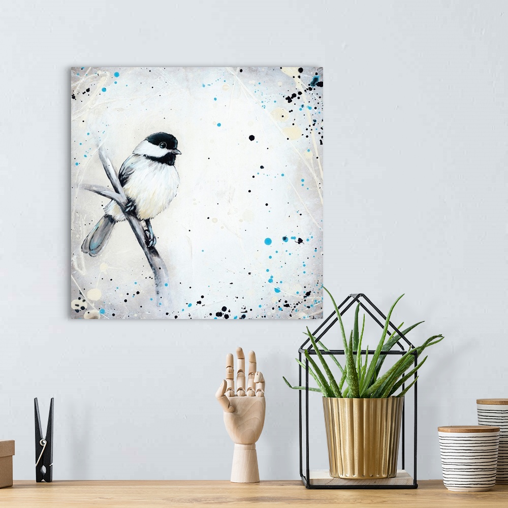 A bohemian room featuring Painting of a black-capped chickadee perched on a branch, surrounded by black and blue paint spla...