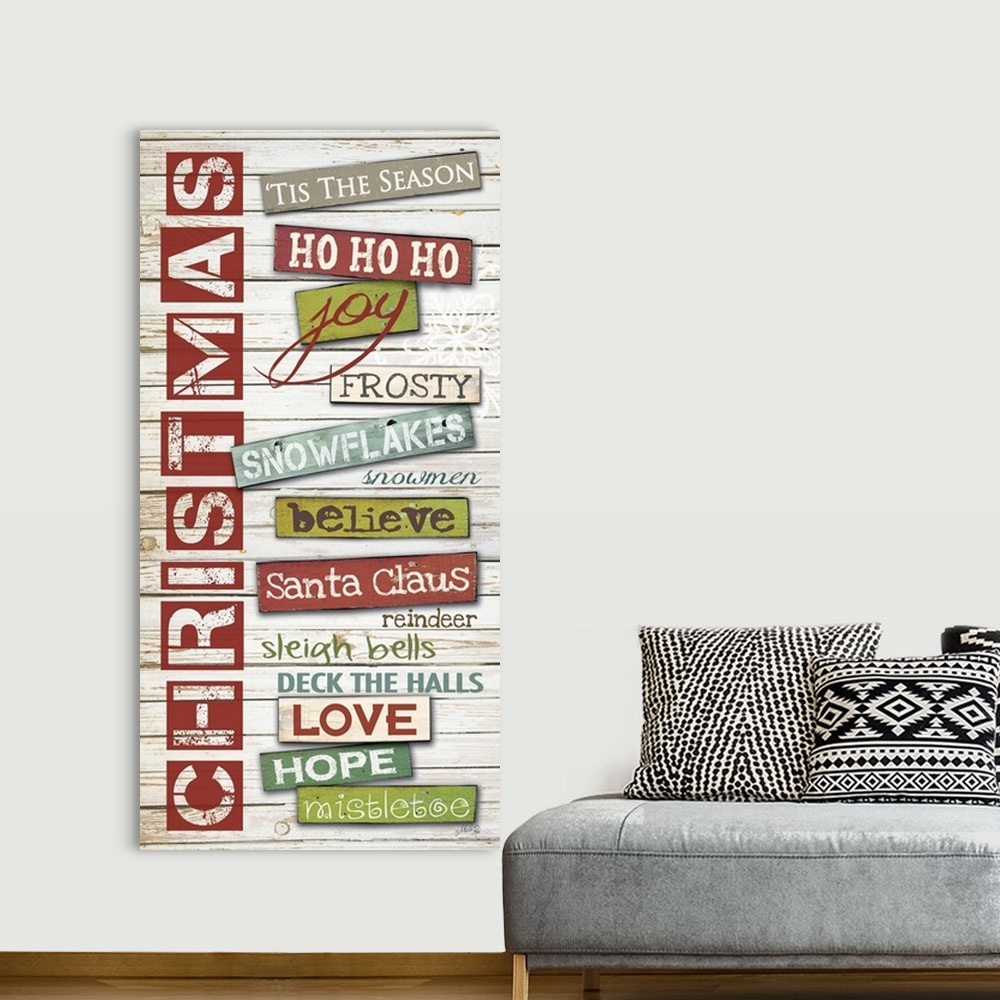 A bohemian room featuring Christmas themed typography hoe decor art.