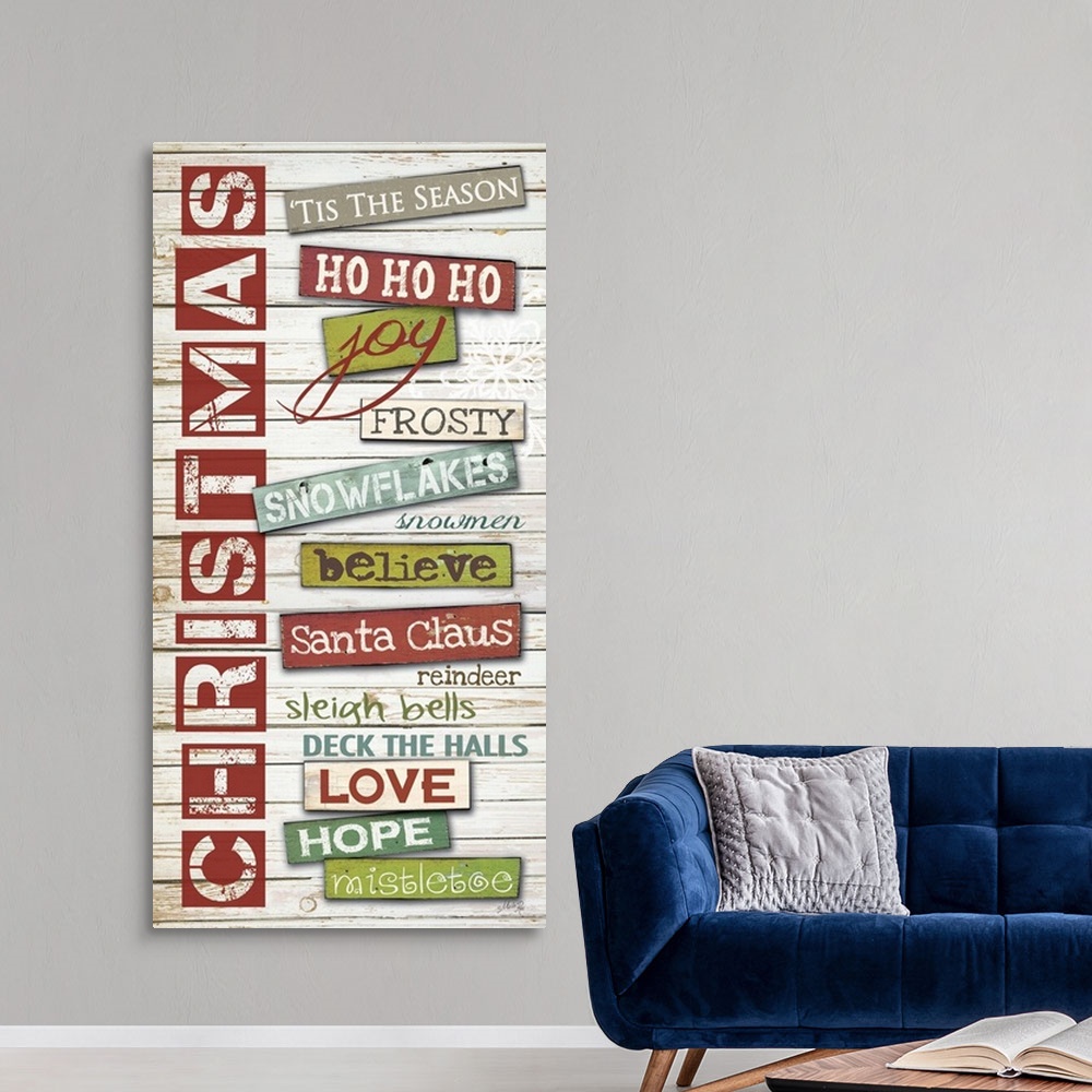 A modern room featuring Christmas themed typography hoe decor art.