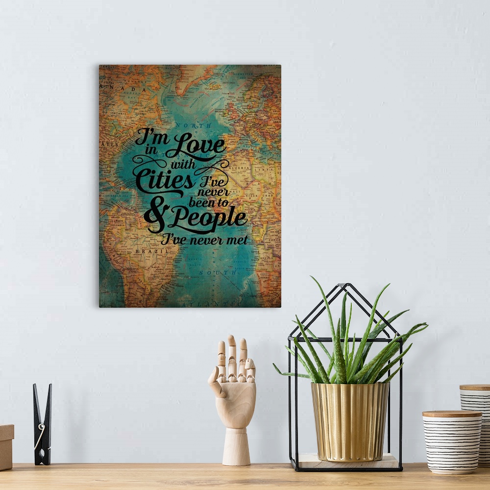 A bohemian room featuring Typography artwork of a sentiment honoring friendship over an image of an antique world map.