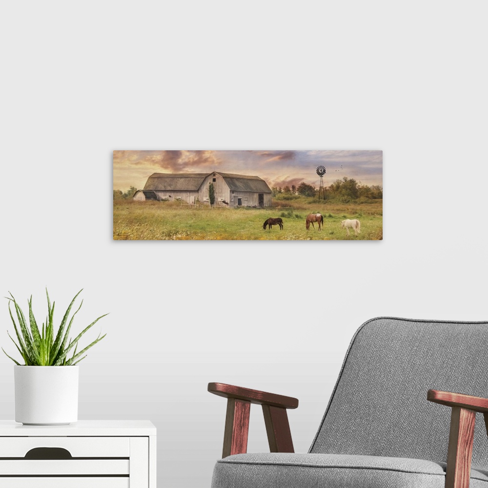 A modern room featuring Horses grazing in a field near a large barn in the country.
