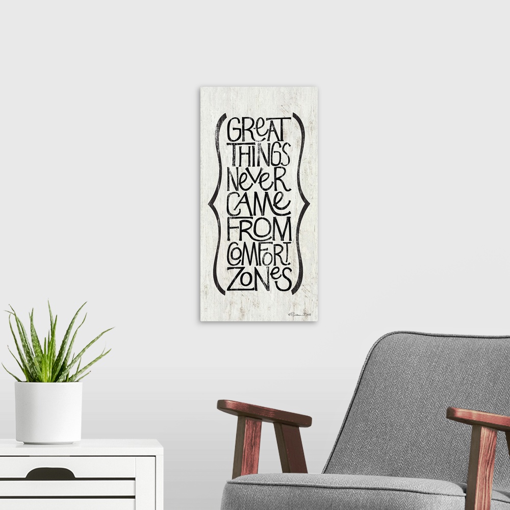 A modern room featuring Typography art of an inspirational sentiment in a vertical column with a parentheses motif.