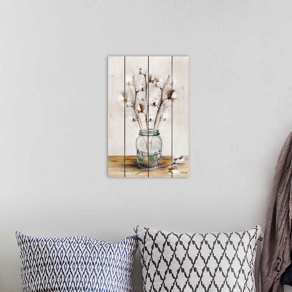 A bohemian room featuring Artwork of cotton buds arranged in a glass jar on a wooden board background.