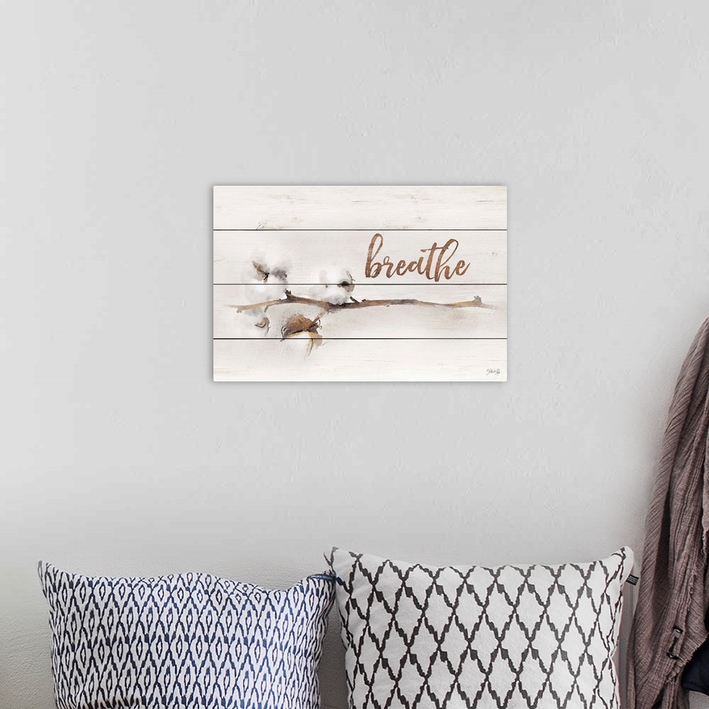A bohemian room featuring A stem with cotton buds and handlettered text over a wooden board background.