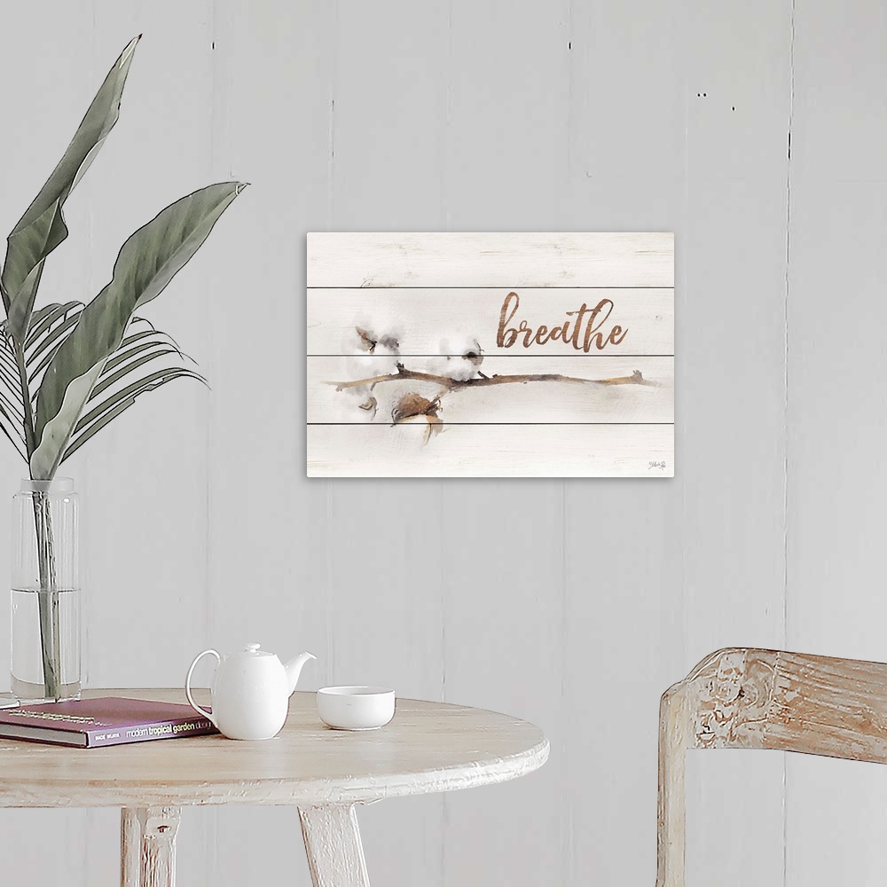A farmhouse room featuring A stem with cotton buds and handlettered text over a wooden board background.