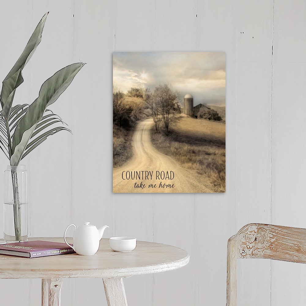 A farmhouse room featuring Text over an image of a dirt road leading to a farm and silo in the countryside.