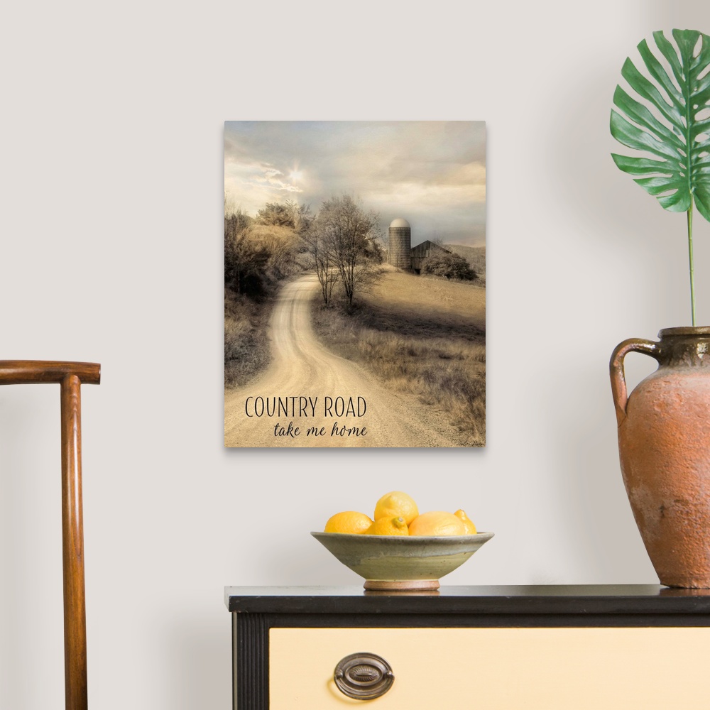 A traditional room featuring Text over an image of a dirt road leading to a farm and silo in the countryside.