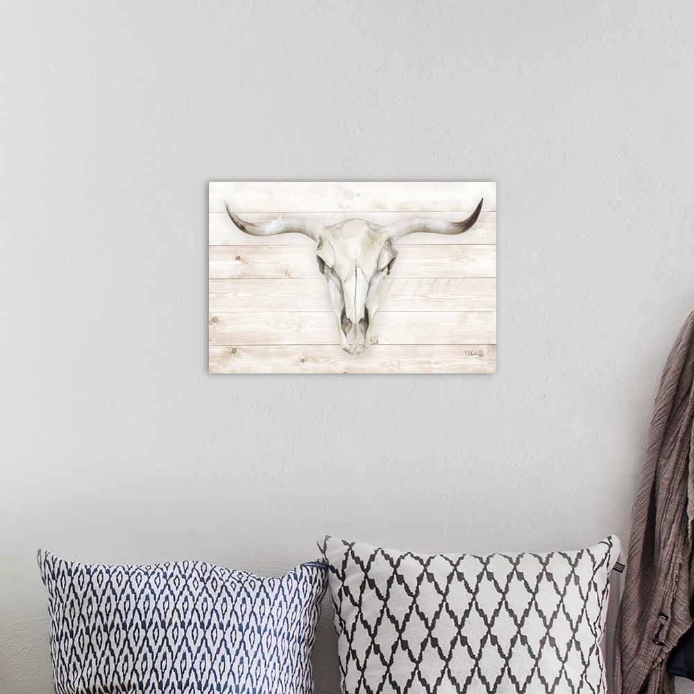 A bohemian room featuring A horizontal digital illustration of a cow skull on a white washed wood background.