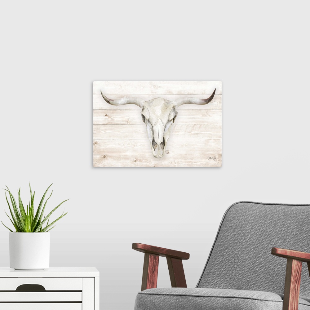 A modern room featuring A horizontal digital illustration of a cow skull on a white washed wood background.