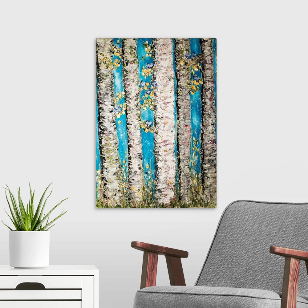A modern room featuring Contemporary artwork of a forest of birch trees with yellow leaves.