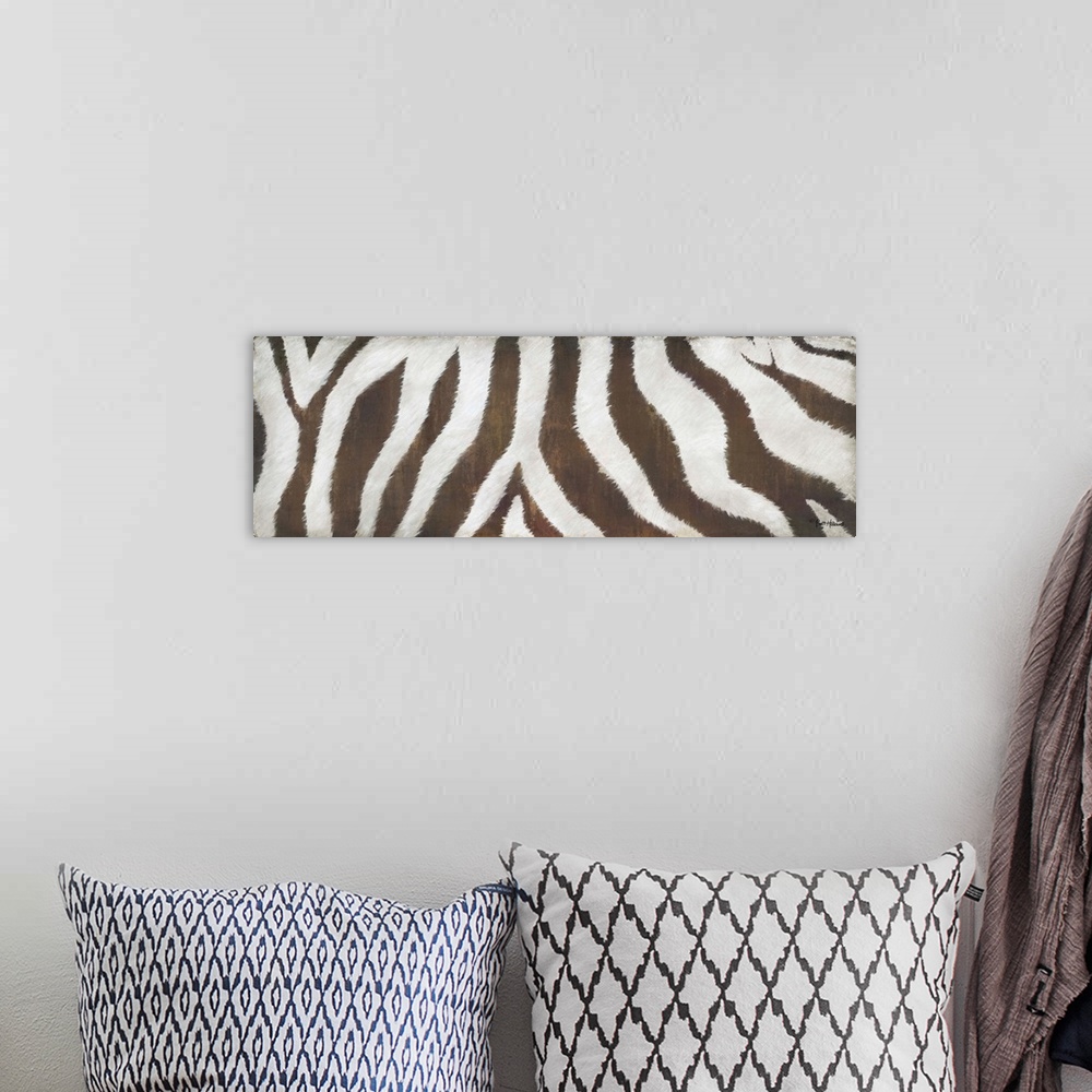 A bohemian room featuring A large horizontal close up of the body of a zebra in white and brown.