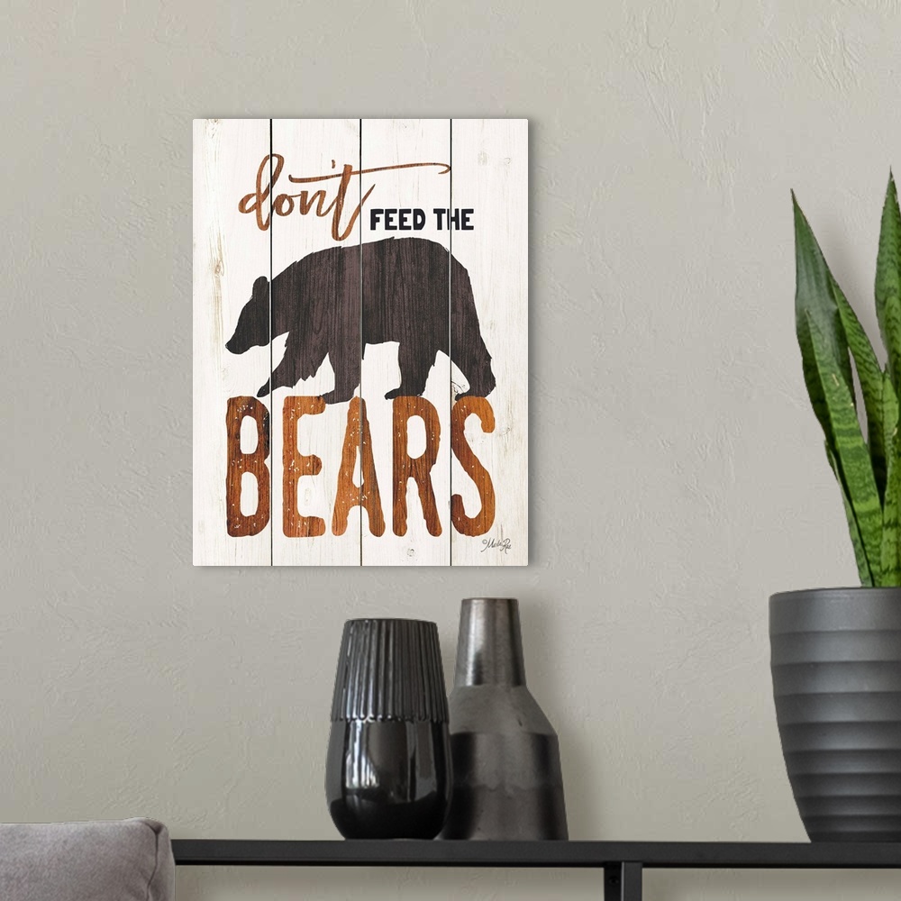 A modern room featuring Fun lodge-themed sign with a bear motif on a wooden board background.