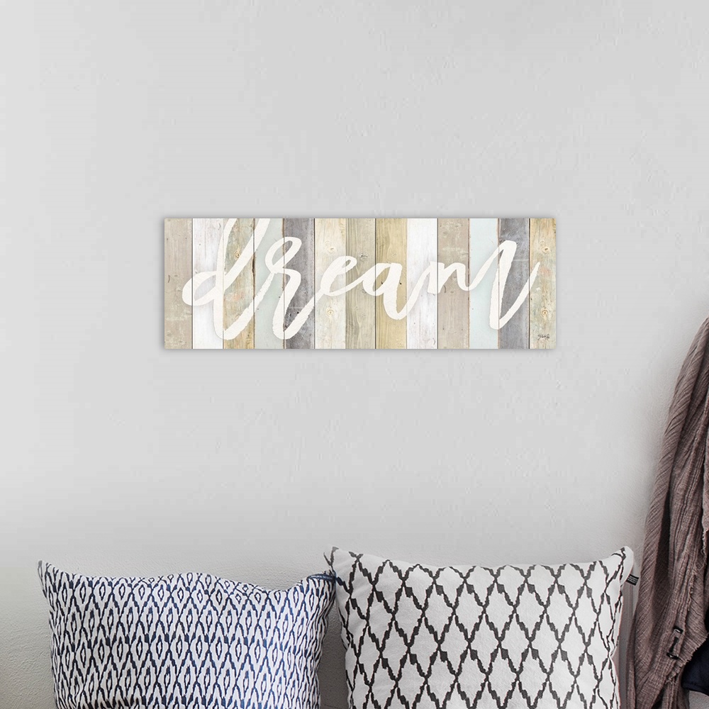 A bohemian room featuring Inspirational typography artwork on a background of various wooden boards.