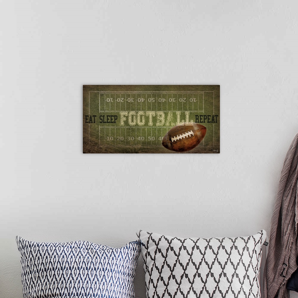 A bohemian room featuring A football typography design with the field with yardlines and a ball.