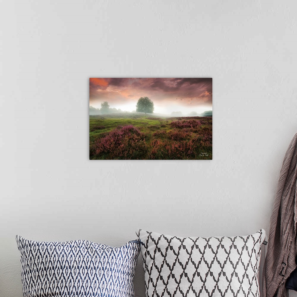 A bohemian room featuring Mist lit up with sunlight over a field in the countryside under heavy clouds.