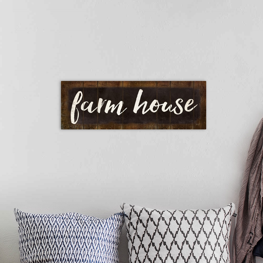 A bohemian room featuring "Farm House" in white handlettered script on a weathered brown background.