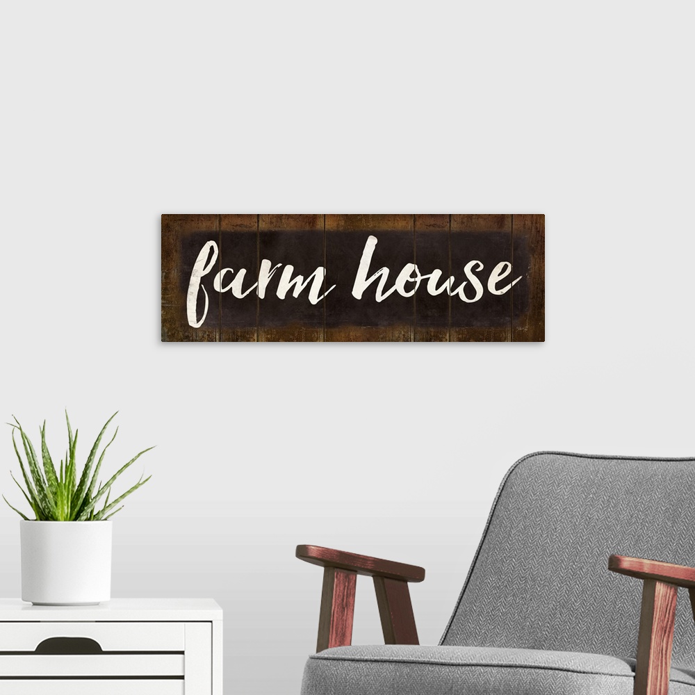 A modern room featuring "Farm House" in white handlettered script on a weathered brown background.