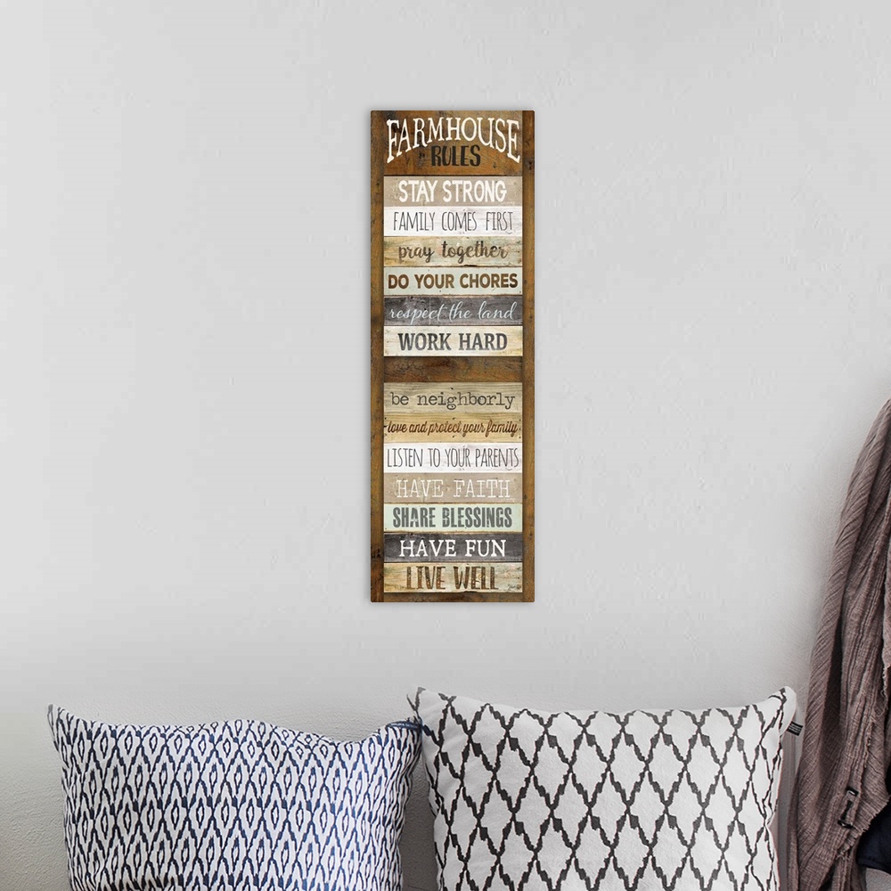 A bohemian room featuring Typography art of a list of farmhouse "Rules" such as doing chores and having fun, with the sembl...