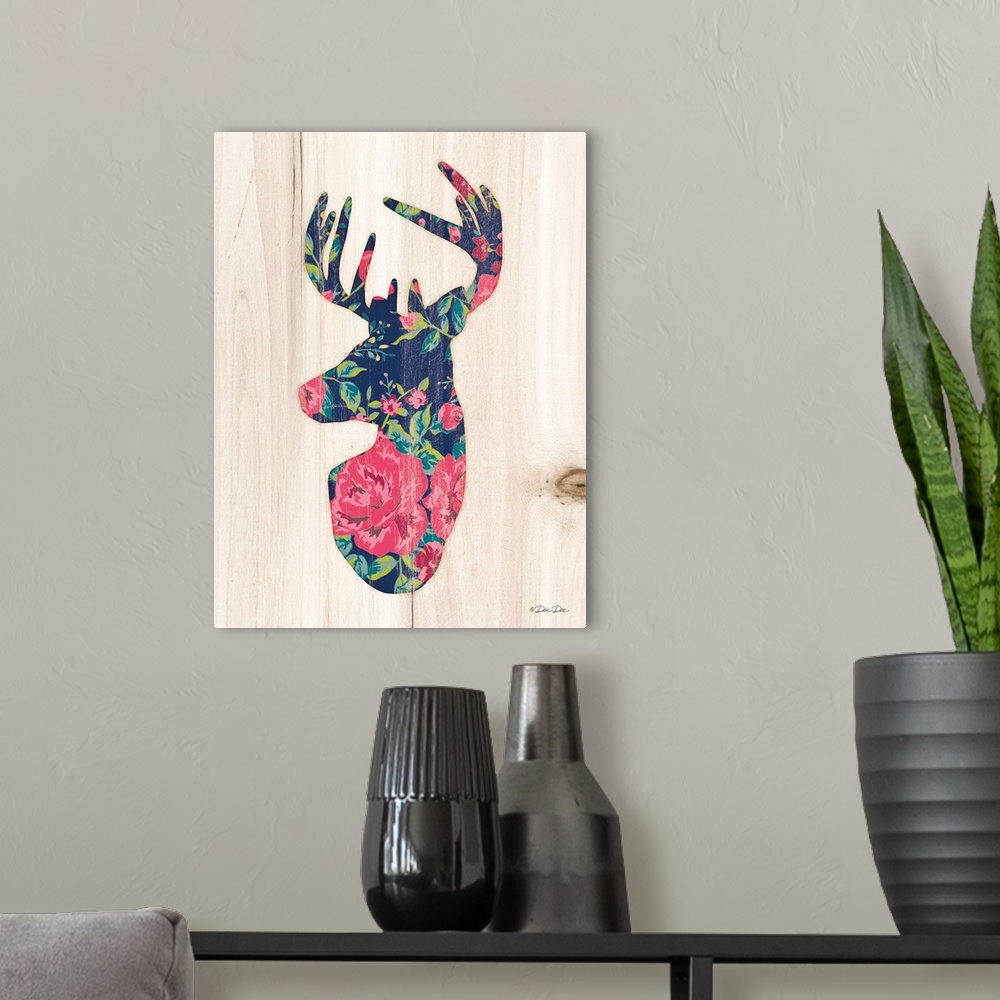 A modern room featuring Silhouette of a deer with a pink and navy floral motif.