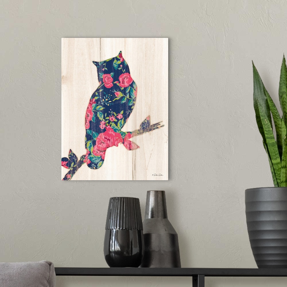 A modern room featuring Silhouette of an owl with a pink and navy floral motif.