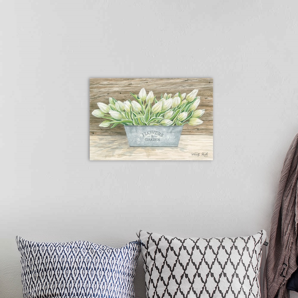 A bohemian room featuring Decorative artwork of a planter filled with tulips.