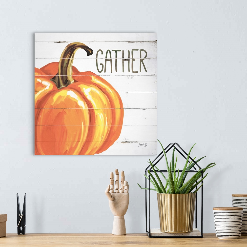 A bohemian room featuring Square Autumn decor with a painted pumpkin on a faux white washed wood background with "Gather" w...