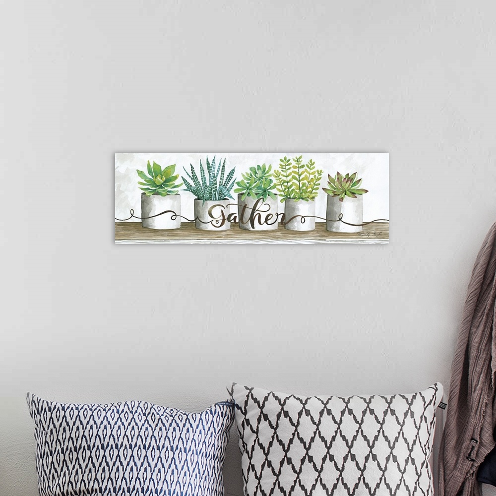 A bohemian room featuring The word, gather, is placed over planters filled with bright green and blue succulents.