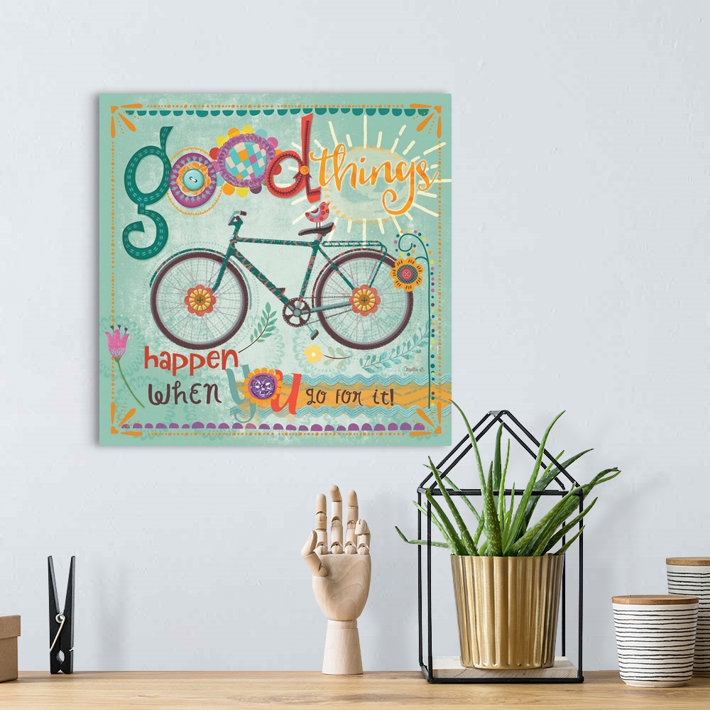 A bohemian room featuring Fun text in bright colors with a bicycle and floral elements.