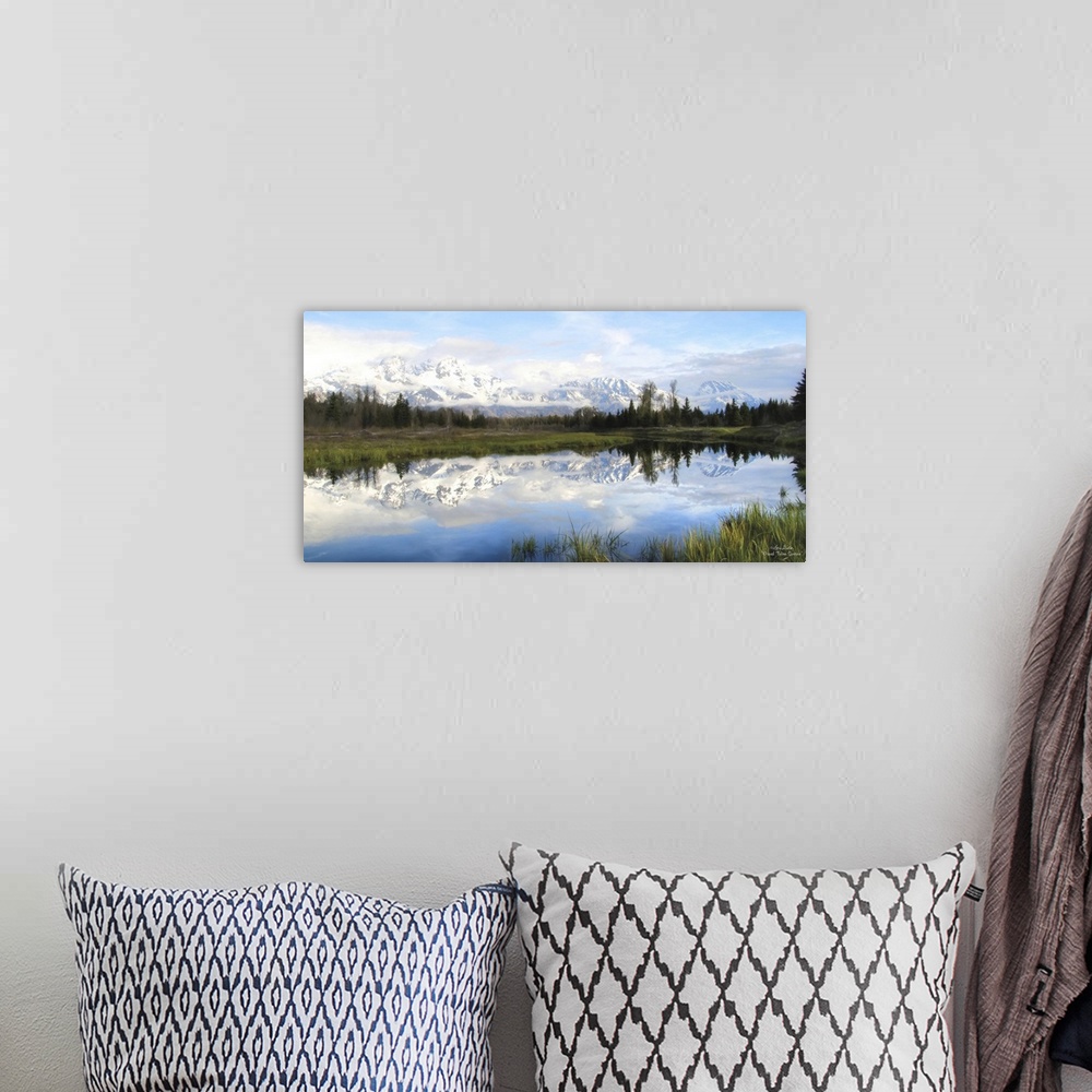 A bohemian room featuring Panoramic photo of the Grand Teton mountains in the morning, reflected in the lake below.