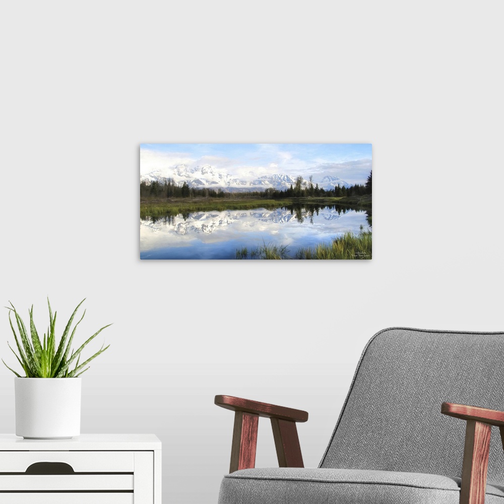 A modern room featuring Panoramic photo of the Grand Teton mountains in the morning, reflected in the lake below.