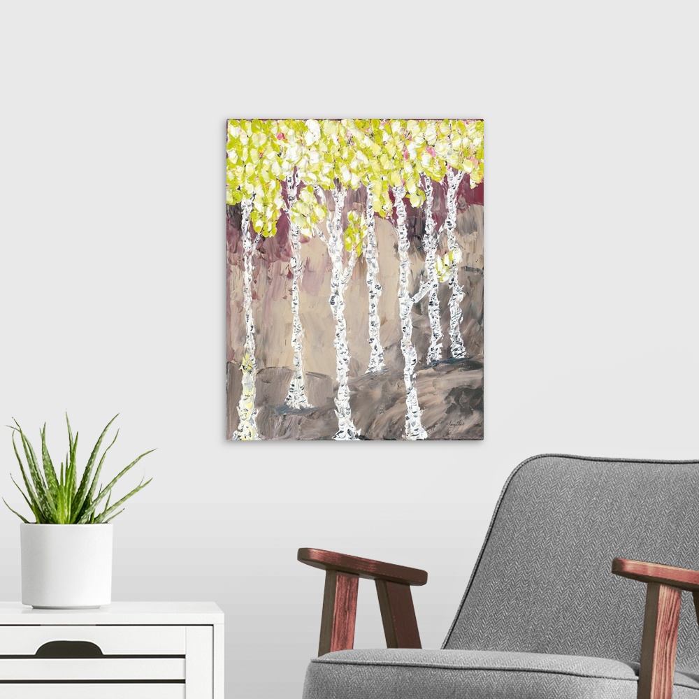 A modern room featuring Contemporary artwork of a forest of thin birch trees with yellow leaves.