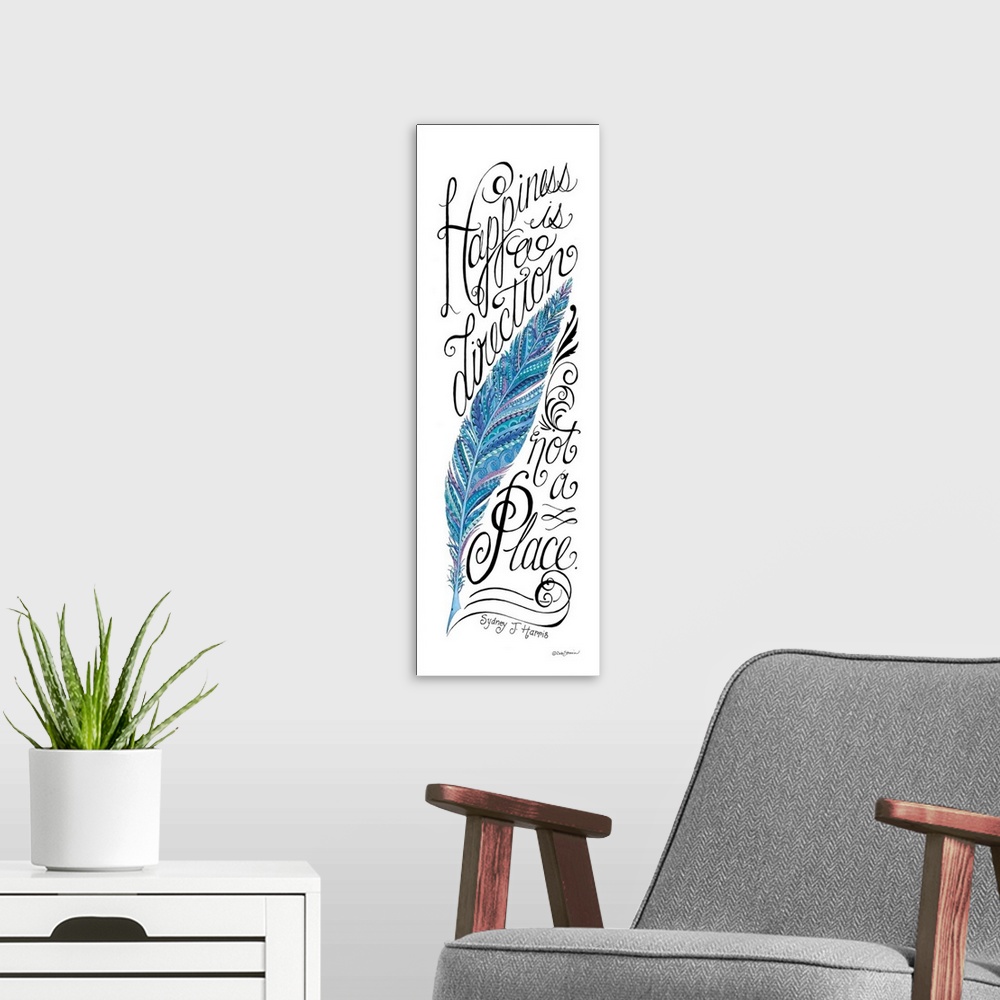 A modern room featuring Vertical handlettered artwork of an inspirational quote, with a blue feather design.