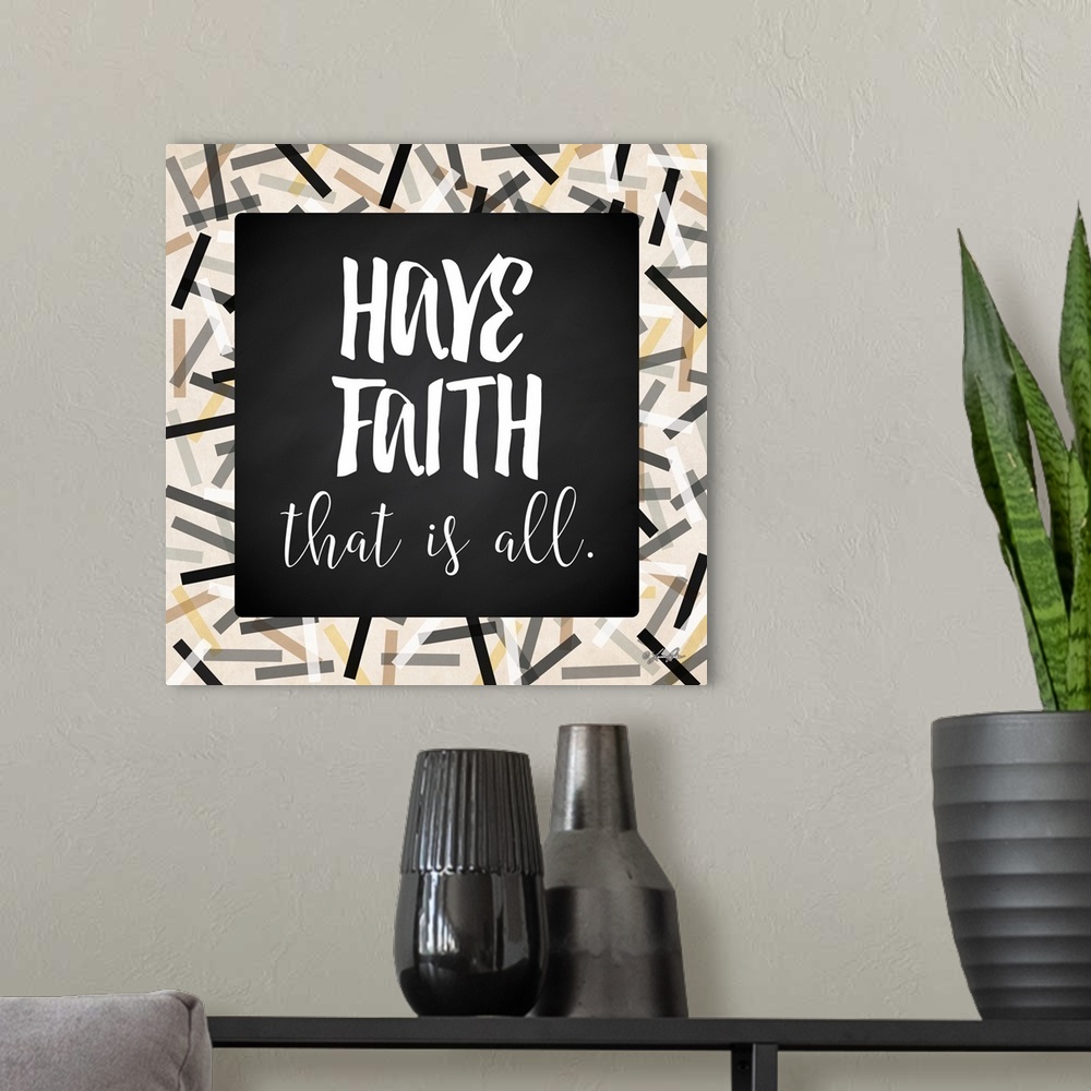 A modern room featuring Inspirational typography art in black and white with a festive frame.