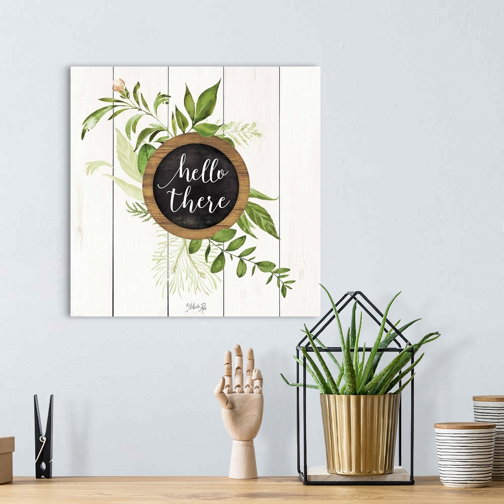A bohemian room featuring "Hello There" with greenery on a white shiplap background.
