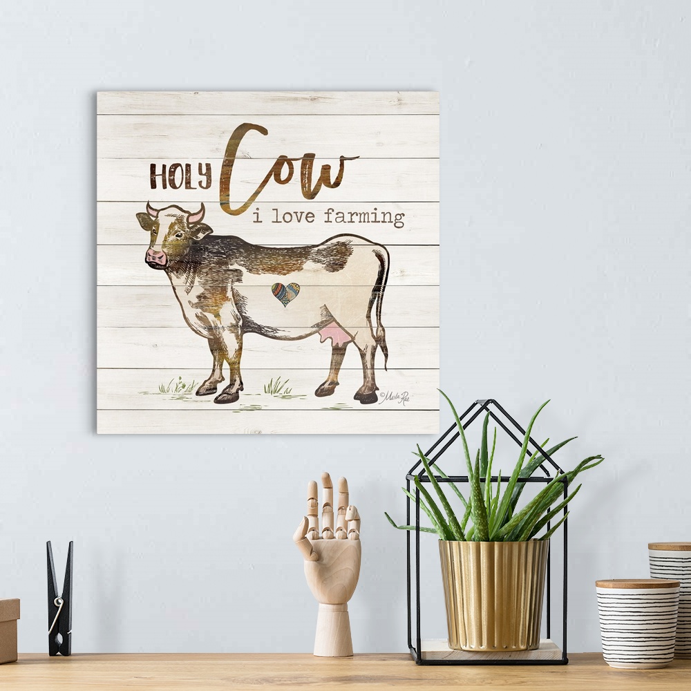 A bohemian room featuring Illustration of a cow with humorous text on a white board background.