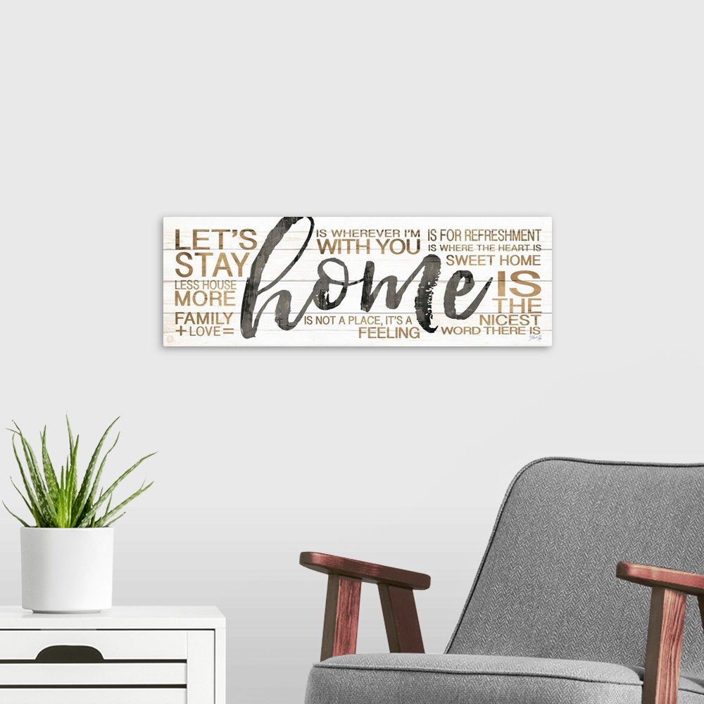 A modern room featuring Typography artwork of the word "home" in large black script, surrounded by family-themed words in...